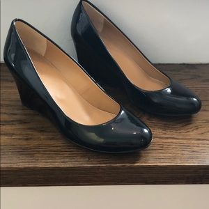 Black patent leather wedges